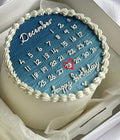 Cake with a blue calendar design and 'happy birthday' text