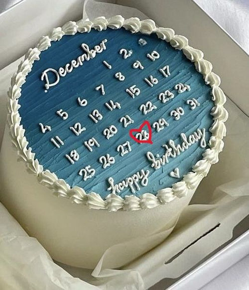 Cake with a blue calendar design and 'happy birthday' text