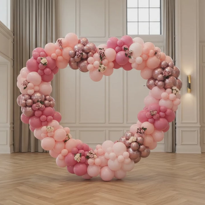 Book luxury pink & rose gold heart balloon backdrops with LED neon signs in Dubai. Ideal for marriage proposals, anniversaries & birthdays across UAE.